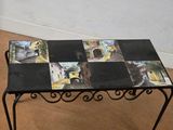 a small table with pictures on the top of it