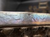 a close up of a metal object with a blurry background
