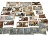 many different types of paper money are arranged on a white surface