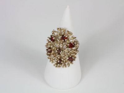 a close up of a white cone with a ring on top of it