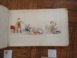 an open book with drawings of people and animals on it