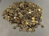 a pile of gold coins sitting on a table