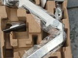 a box of tools sitting on the ground next to a pair of scissors