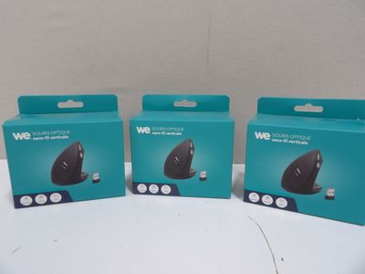 three boxes of wireless mouses sitting on top of a table