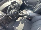 a picture of a car interior with a steering wheel and dashboard