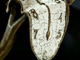 a sculpture of a horse ' s head hanging on a wall