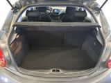 the back of a car with its trunk open and the back seats down