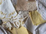 many different types of cloths laid out on a bed
