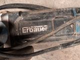 a close up of a corded electric tool on the ground