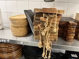 a pile of wood stacked on a shelf in a kitchen