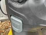 a vacuum that is sitting on the ground next to a box