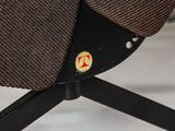 a brown hat sitting on top of a black chair