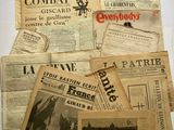many old newspapers that are on the table