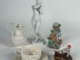 a lot of figurines that are sitting on a table
