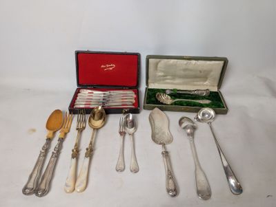 a lot of silverware in a case on a table