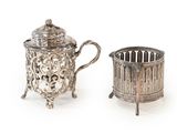 two silverplated teapots and a cup on stands