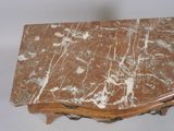 a marble top table with a wooden base on a white background