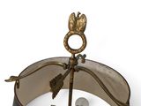 a metal object with a bird on top of it