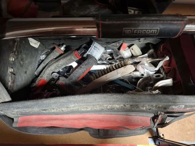 a bag full of tools sitting on top of a table