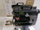 an image of a black sewing machine sitting on top of a table
