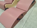 two pink recliners that are sitting on the floor