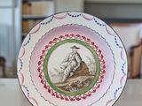 a plate that has a picture of a man on it