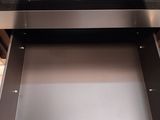 a silver oven with a glass door and a drawer underneath it