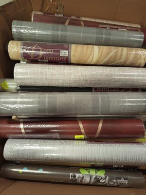 many rolls of wrapping paper in a cardboard box