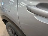 a close up of a car door handle on the side of the car