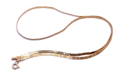 a long gold leash with a metal clasp on it