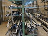 a large pile of pipes and tubes in a warehouse