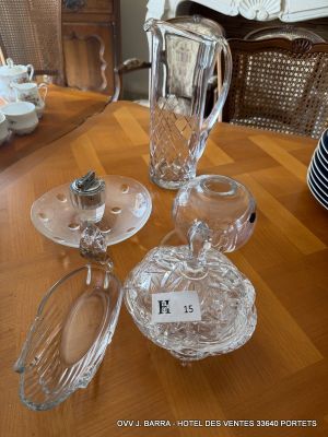 a lot of glass items sitting on a wooden table