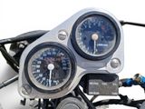 a close up of a motorcycle with a speedometer and gauges