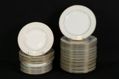 several plates stacked on top of each other on a black surface