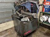 a machine that is sitting inside of a garage