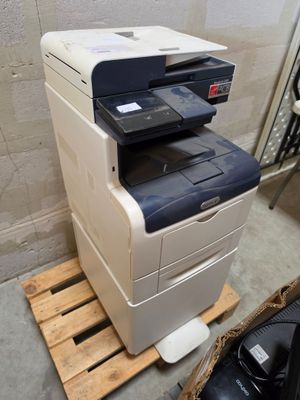 a printer that is sitting on top of a pallet
