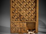 a wooden box filled with coins and a card game