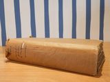 a brown book with writing on it sitting on a wooden table