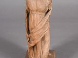 statue of a woman in a dress with a shaw around her neck