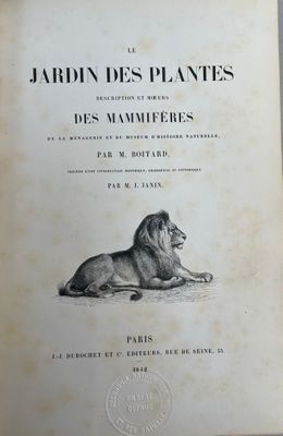 un vieux livre sur lequel est dessiné un lion couché sur le flanc