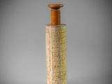 a close up of a cork stopper on a gray background