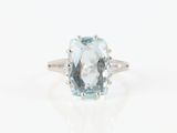 an image of a ring with a blue topaz stone