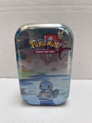pokemon trading card tin with a small figure in it