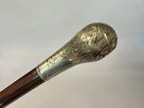 a close up of a walking stick with a stick handle