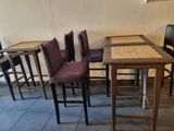 several chairs and a table in a room with a tile floor
