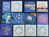 several different types of coins are arranged on a table