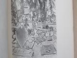 an open book with a drawing of a man sitting at a desk