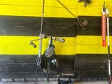 yellow and black striped wall with tools and tools on it