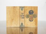a wooden box with a design on it on a table