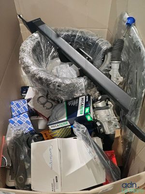 a cardboard box filled with assorted items in it